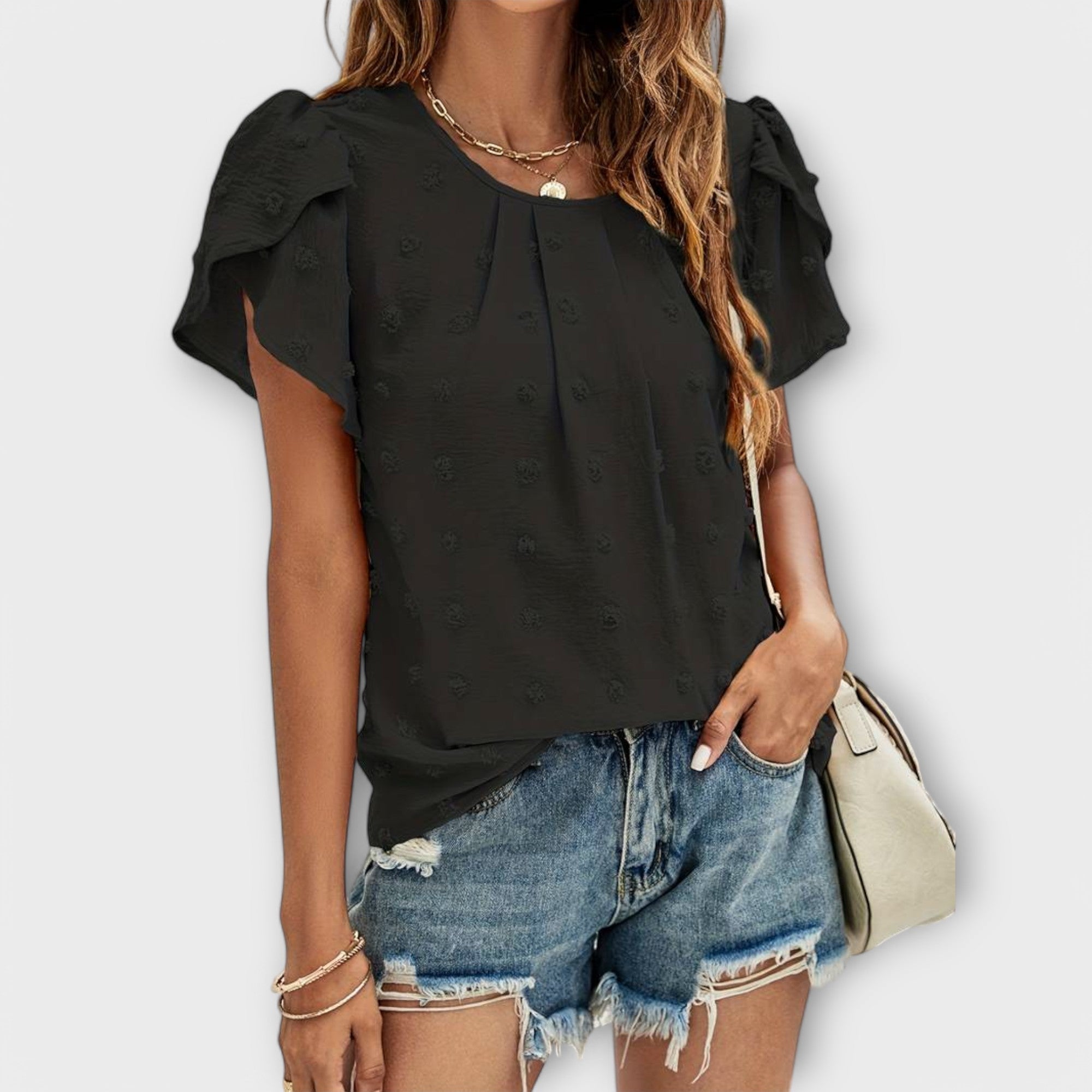 Blouse à pois et manches fleuries – Élégance féminine chic