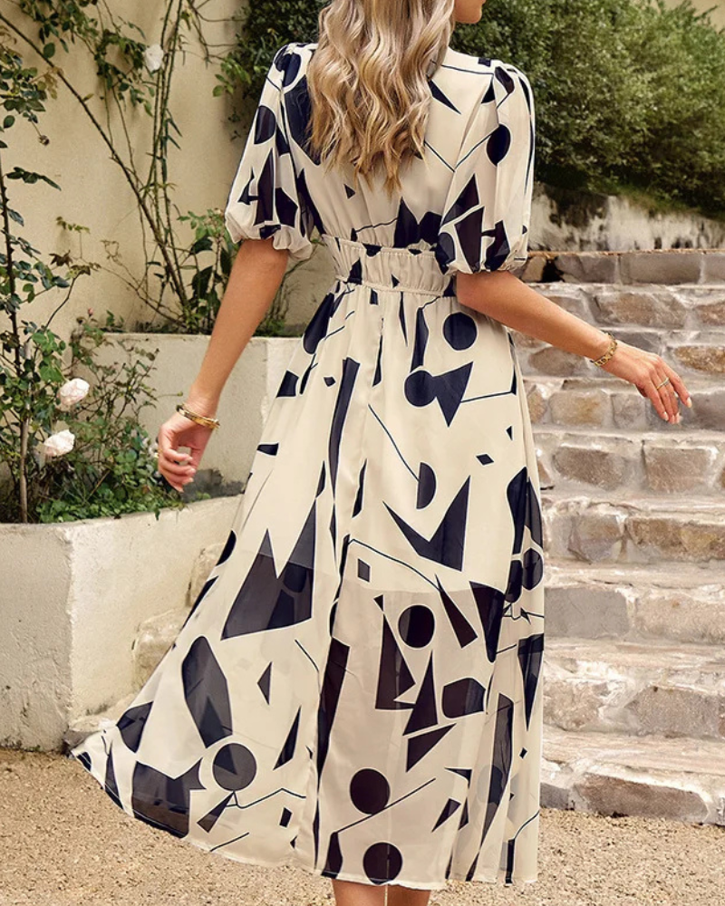 Elegant floral midi dress with puff sleeves, fitted waist, and V-neck collar