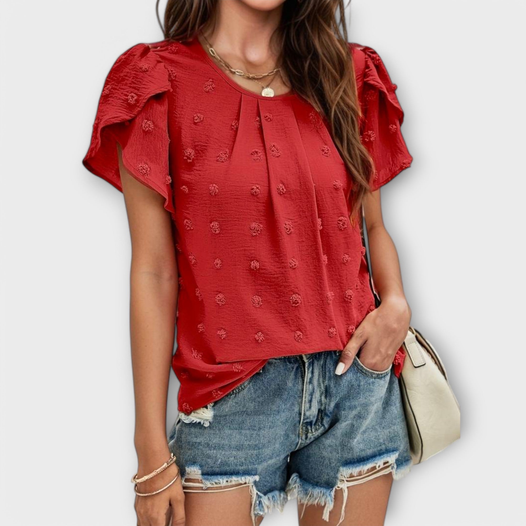 Blouse à pois et manches fleuries – Élégance féminine chic