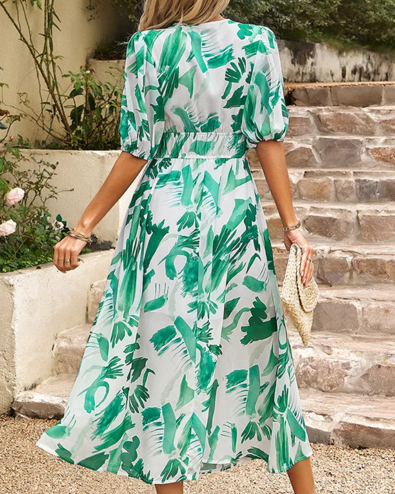 Elegant floral midi dress with puff sleeves, fitted waist, and V-neck collar