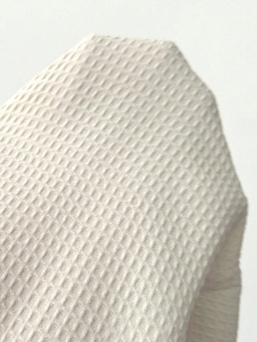 Asymmetrical minimalist casual wrap skirt in textured fabric tied