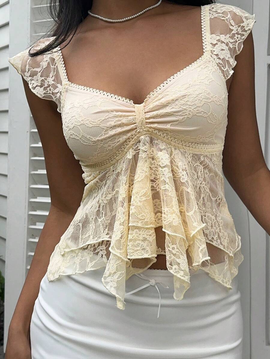 Flirty lace top with ruffles, sweetheart neckline and short sleeves