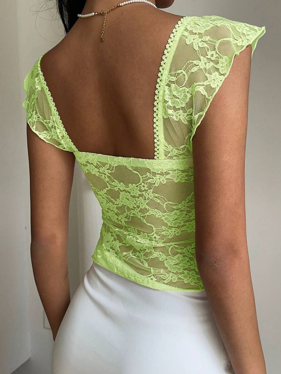 Flirty lace top with ruffles, sweetheart neckline and short sleeves
