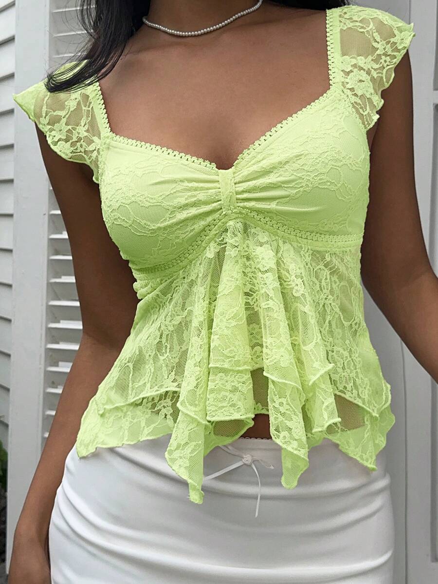 Flirty lace top with ruffles, sweetheart neckline and short sleeves