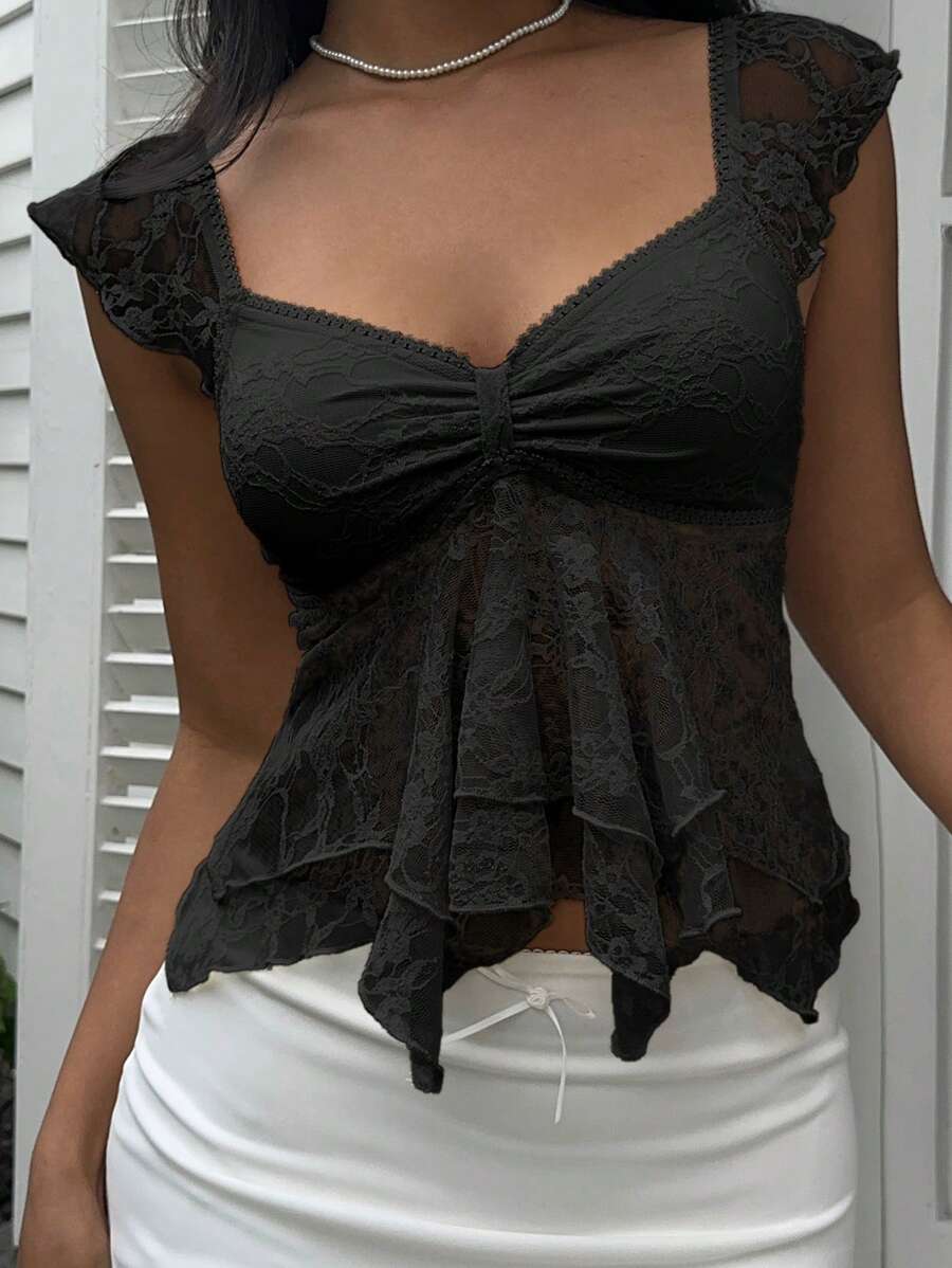 Flirty lace top with ruffles, sweetheart neckline and short sleeves