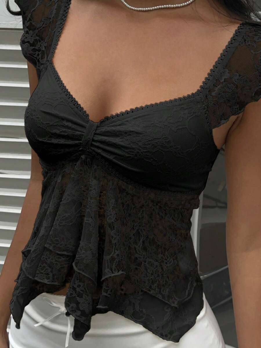 Flirty lace top with ruffles, sweetheart neckline and short sleeves