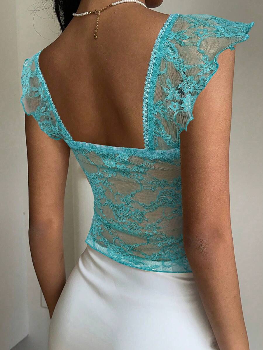 Flirty lace top with ruffles, sweetheart neckline and short sleeves