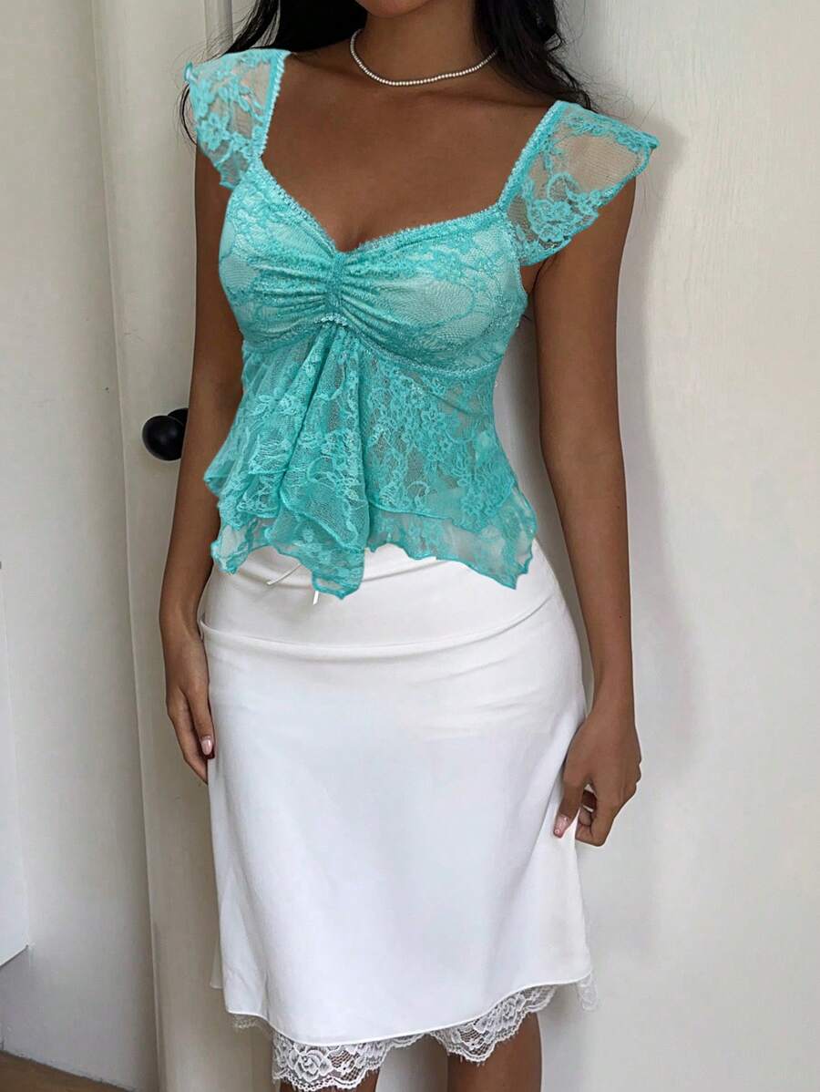 Flirty lace top with ruffles, sweetheart neckline and short sleeves