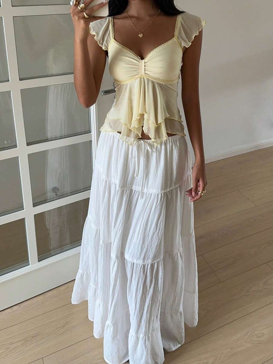 Flirty lace top with ruffles, sweetheart neckline and short sleeves