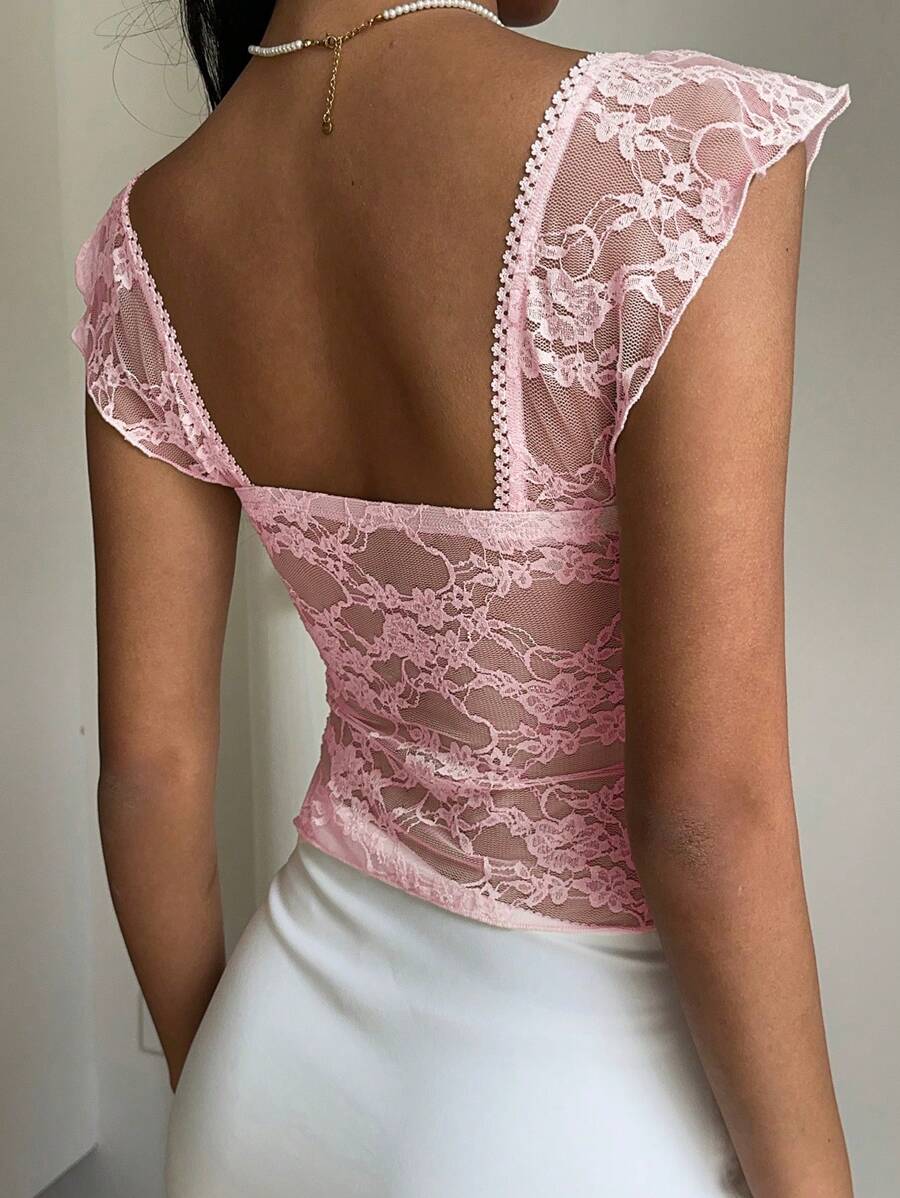 Flirty lace top with ruffles, sweetheart neckline and short sleeves
