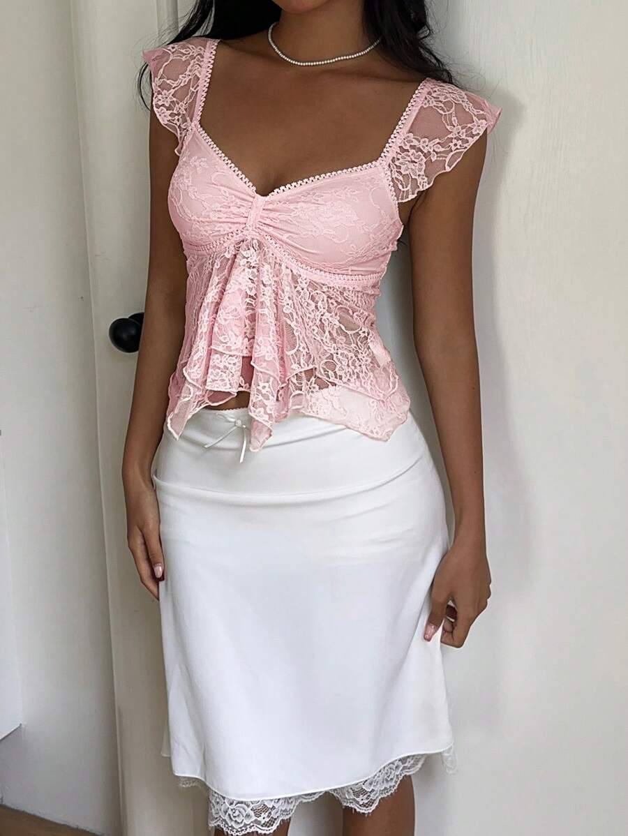 Flirty lace top with ruffles, sweetheart neckline and short sleeves