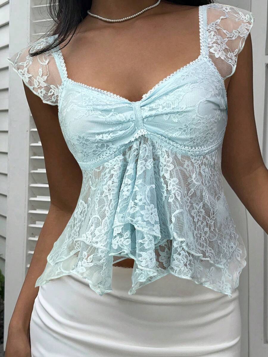 Flirty lace top with ruffles, sweetheart neckline and short sleeves