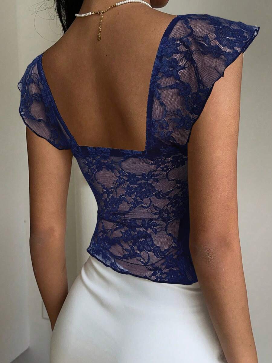 Flirty lace top with ruffles, sweetheart neckline and short sleeves