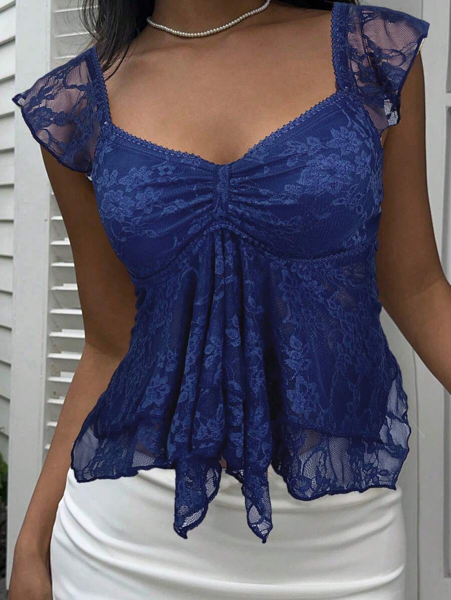 Flirty lace top with ruffles, sweetheart neckline and short sleeves