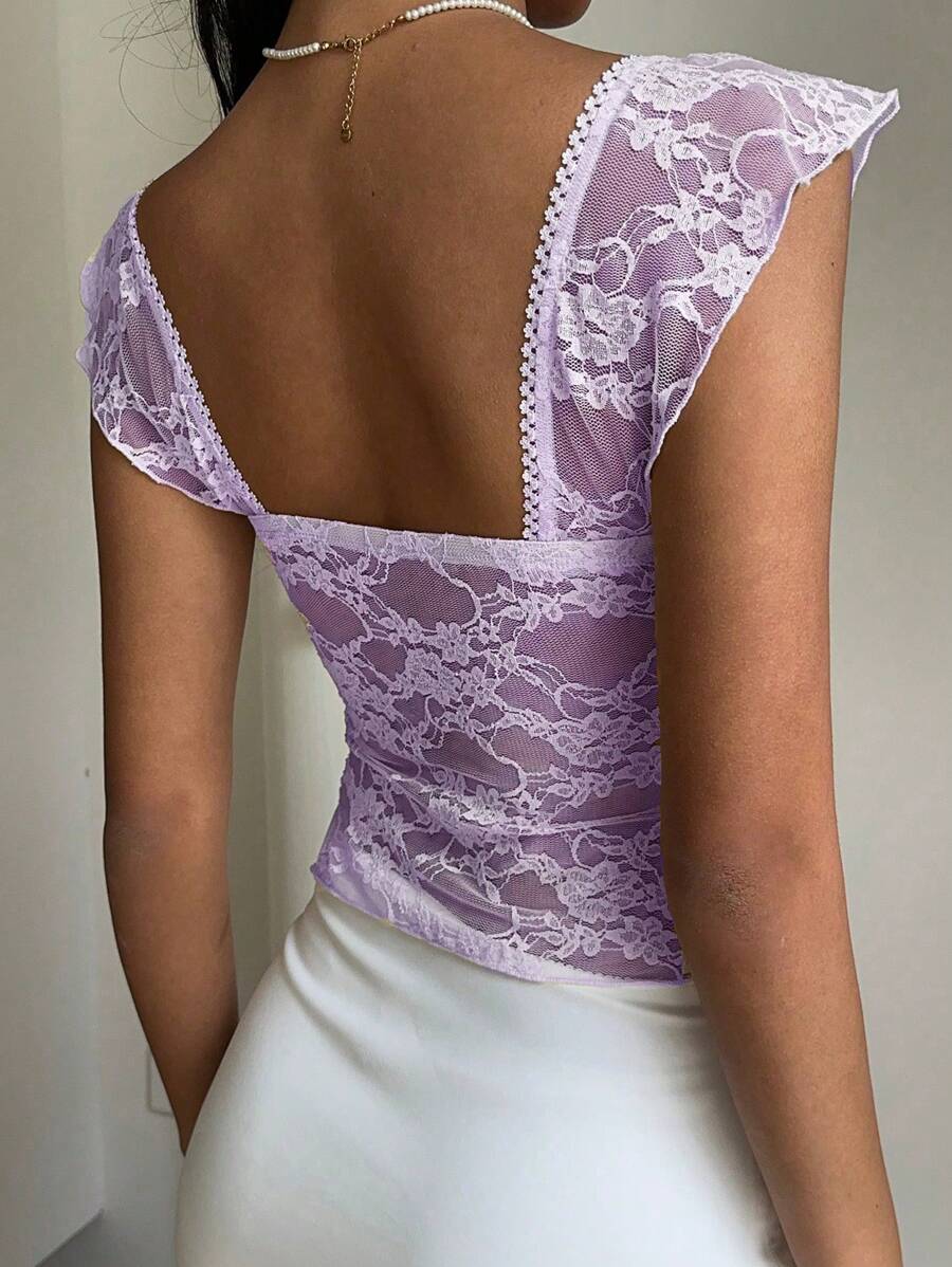 Flirty lace top with ruffles, sweetheart neckline and short sleeves