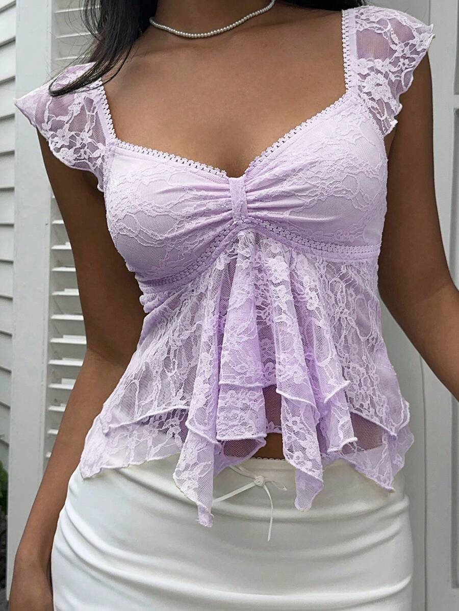 Flirty lace top with ruffles, sweetheart neckline and short sleeves