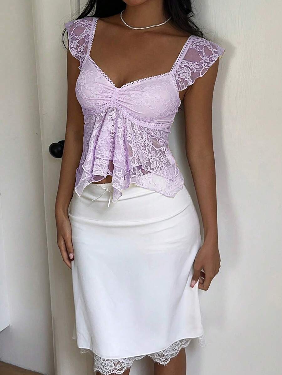 Flirty lace top with ruffles, sweetheart neckline and short sleeves