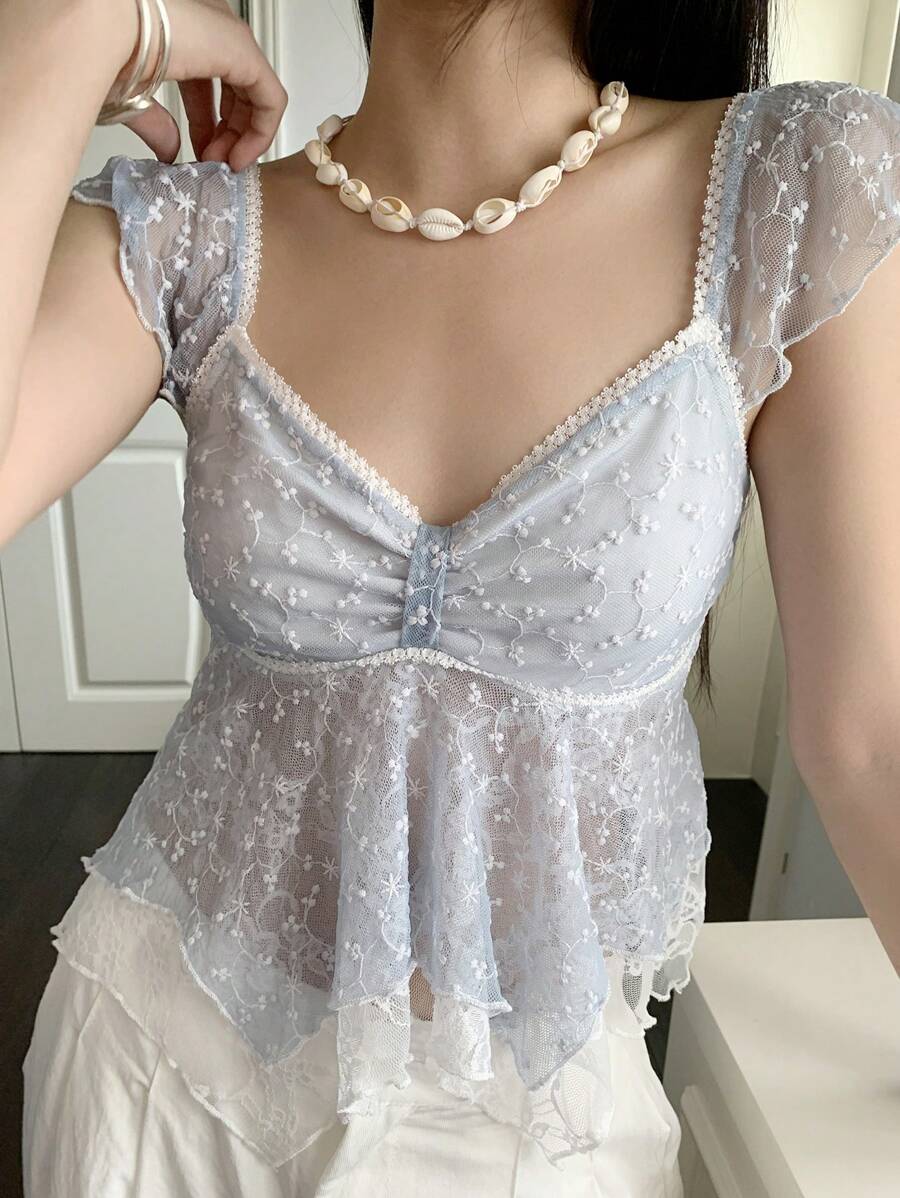 Flirty lace top with ruffles, sweetheart neckline and short sleeves