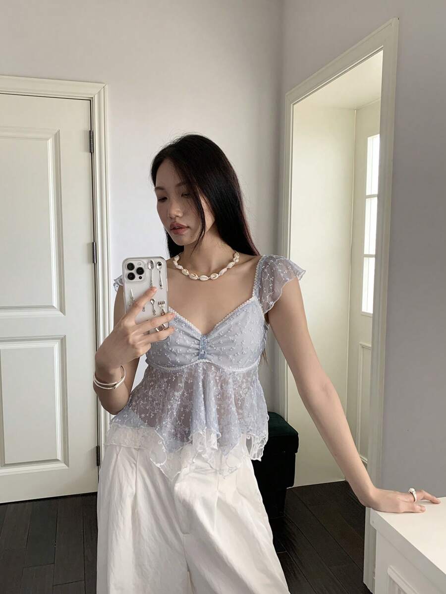 Flirty lace top with ruffles, sweetheart neckline and short sleeves
