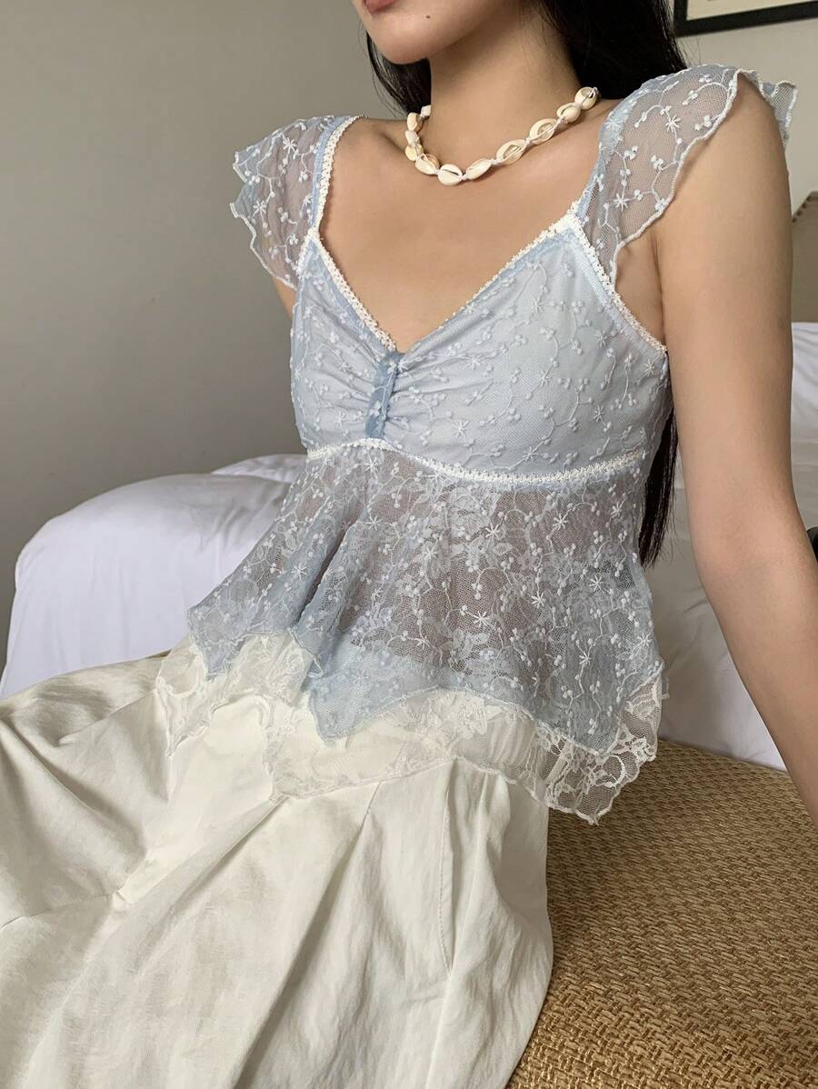 Flirty lace top with ruffles, sweetheart neckline and short sleeves