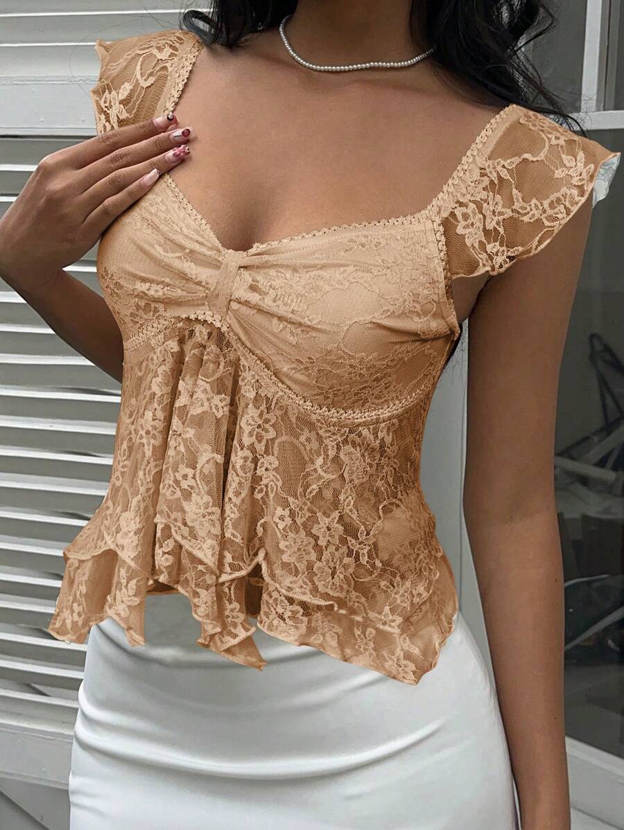 Flirty lace top with ruffles, sweetheart neckline and short sleeves