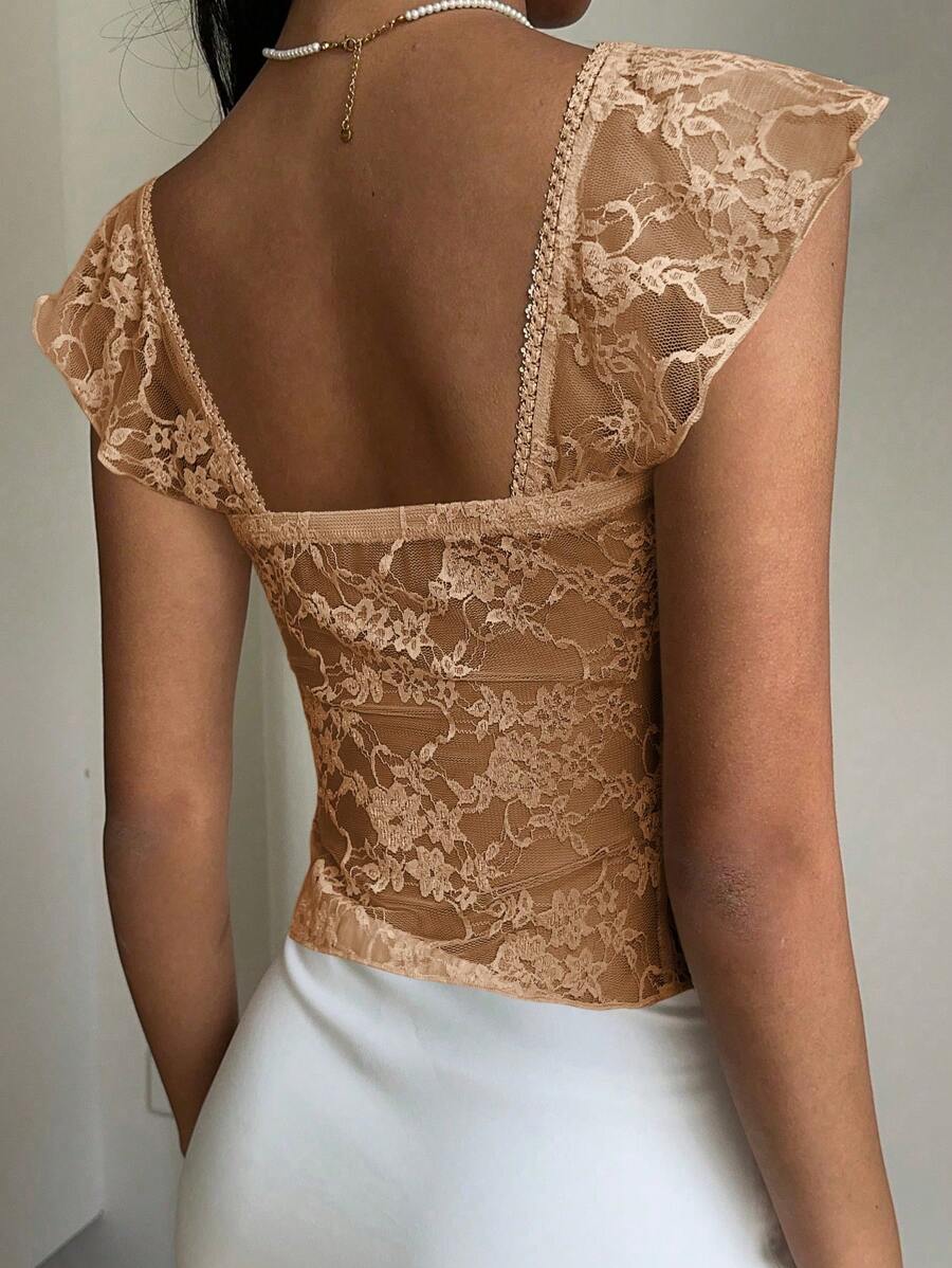 Flirty lace top with ruffles, sweetheart neckline and short sleeves