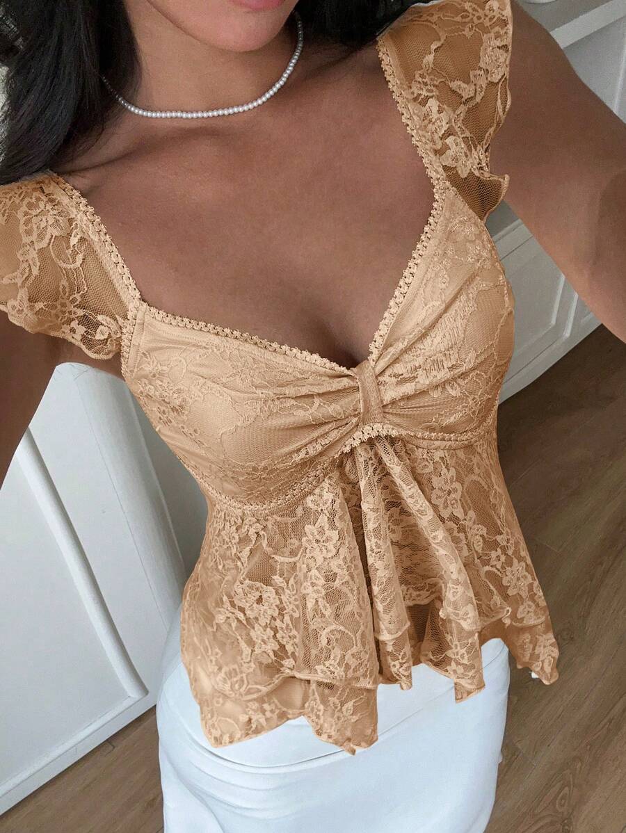 Flirty lace top with ruffles, sweetheart neckline and short sleeves
