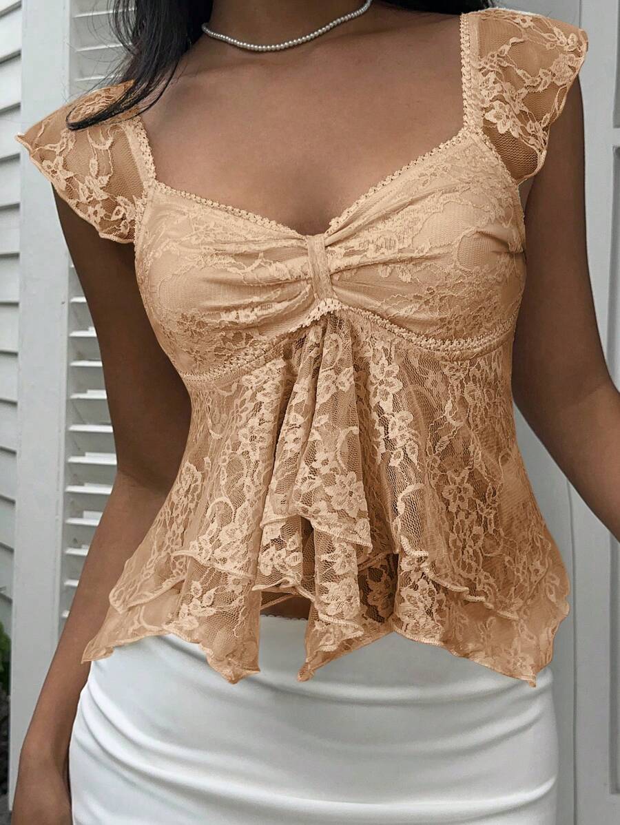 Flirty lace top with ruffles, sweetheart neckline and short sleeves