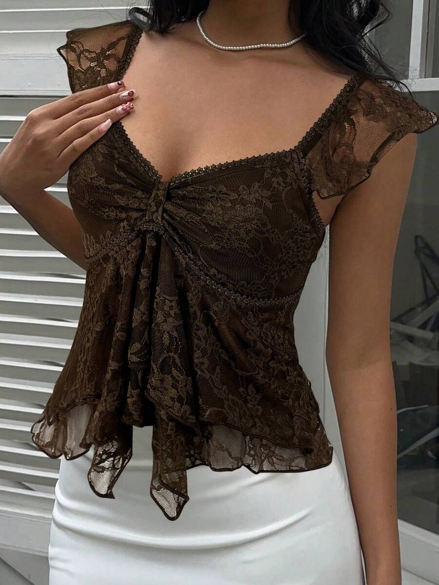 Flirty lace top with ruffles, sweetheart neckline and short sleeves