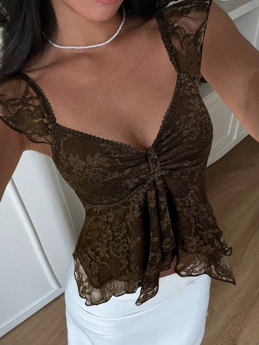 Flirty lace top with ruffles, sweetheart neckline and short sleeves