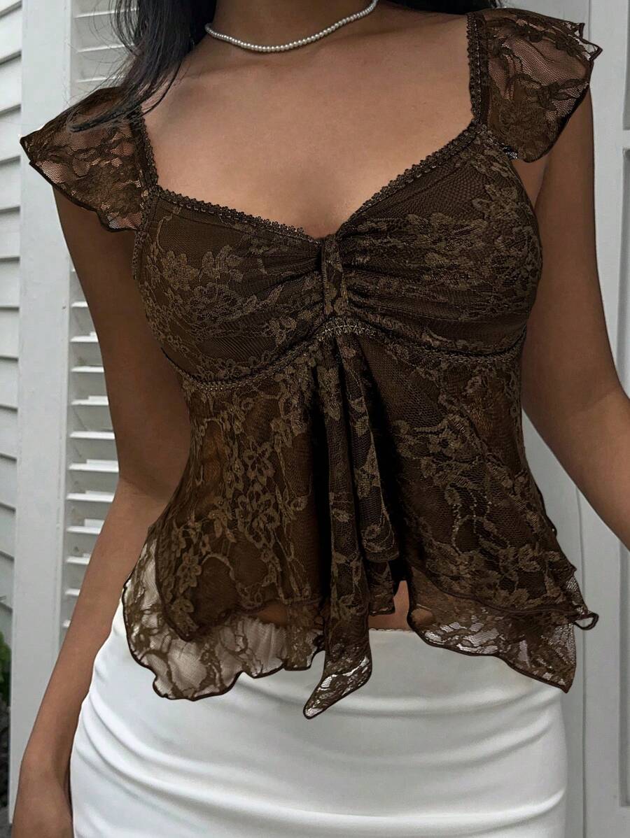 Flirty lace top with ruffles, sweetheart neckline and short sleeves