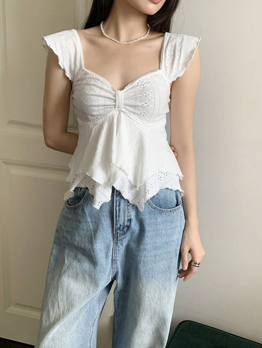 Flirty lace top with ruffles, sweetheart neckline and short sleeves