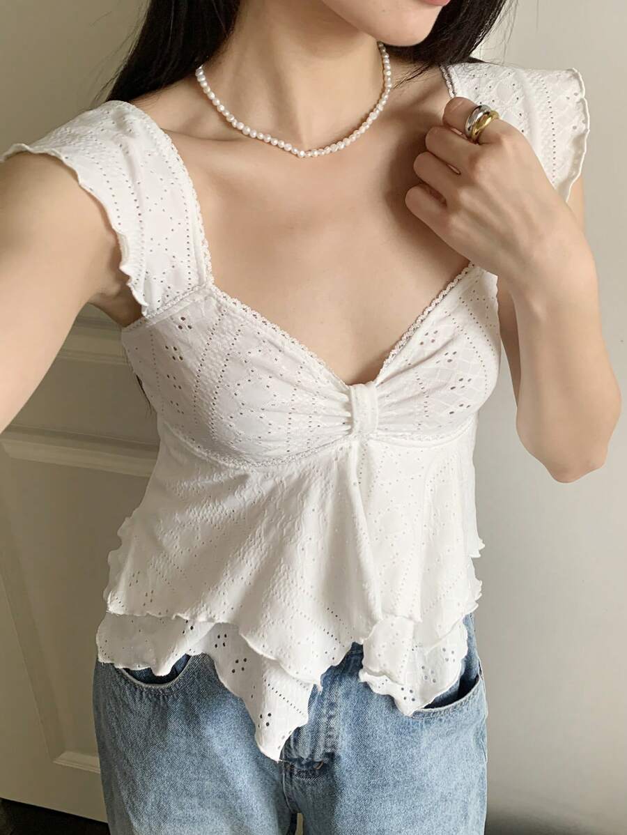 Flirty lace top with ruffles, sweetheart neckline and short sleeves