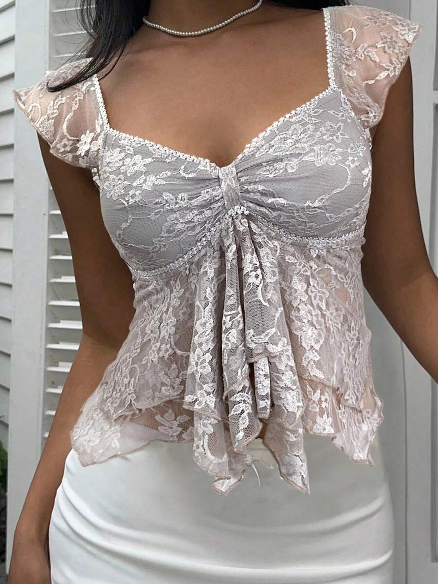 Flirty lace top with ruffles, sweetheart neckline and short sleeves