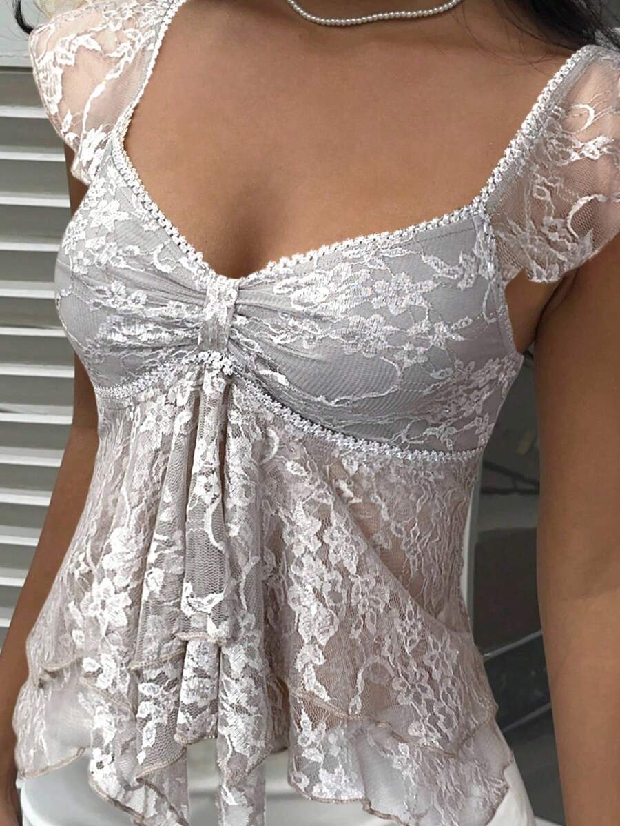 Flirty lace top with ruffles, sweetheart neckline and short sleeves