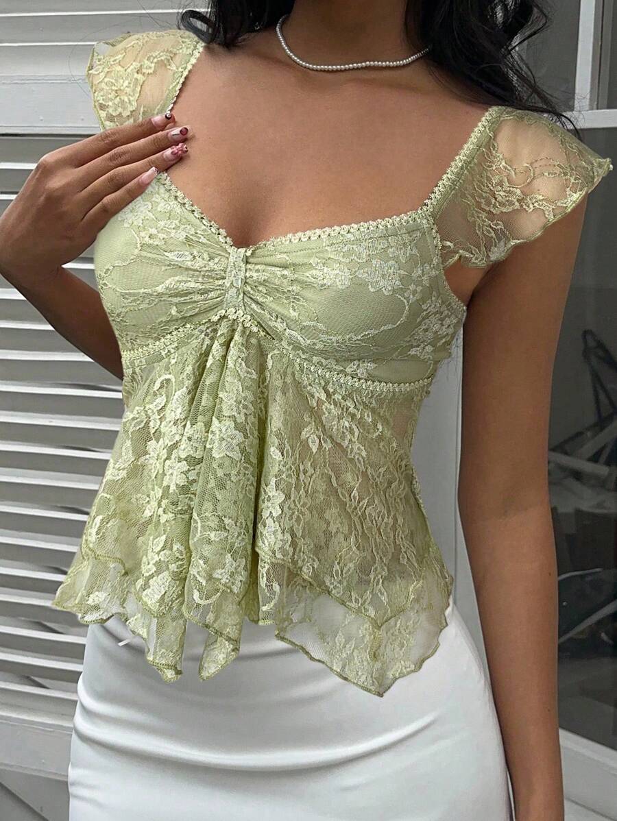 Flirty lace top with ruffles, sweetheart neckline and short sleeves