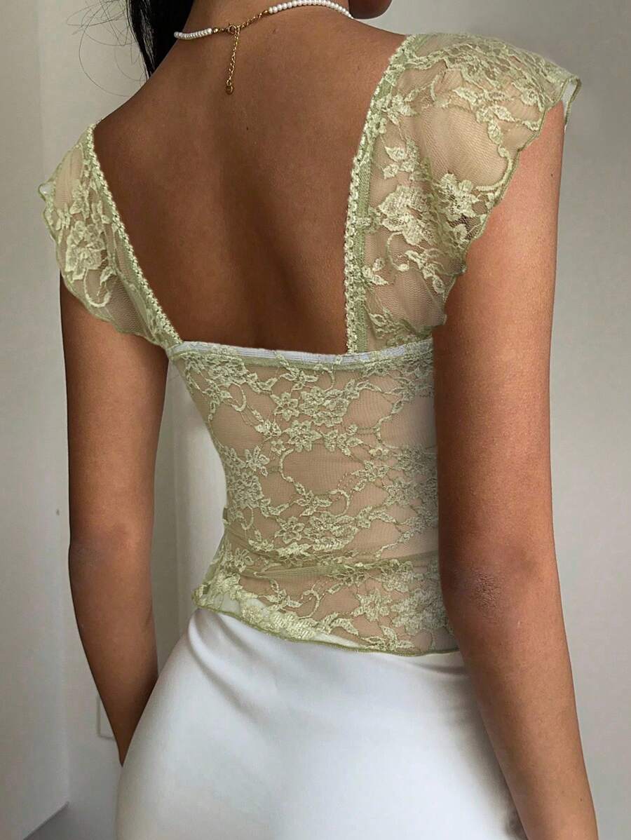 Flirty lace top with ruffles, sweetheart neckline and short sleeves