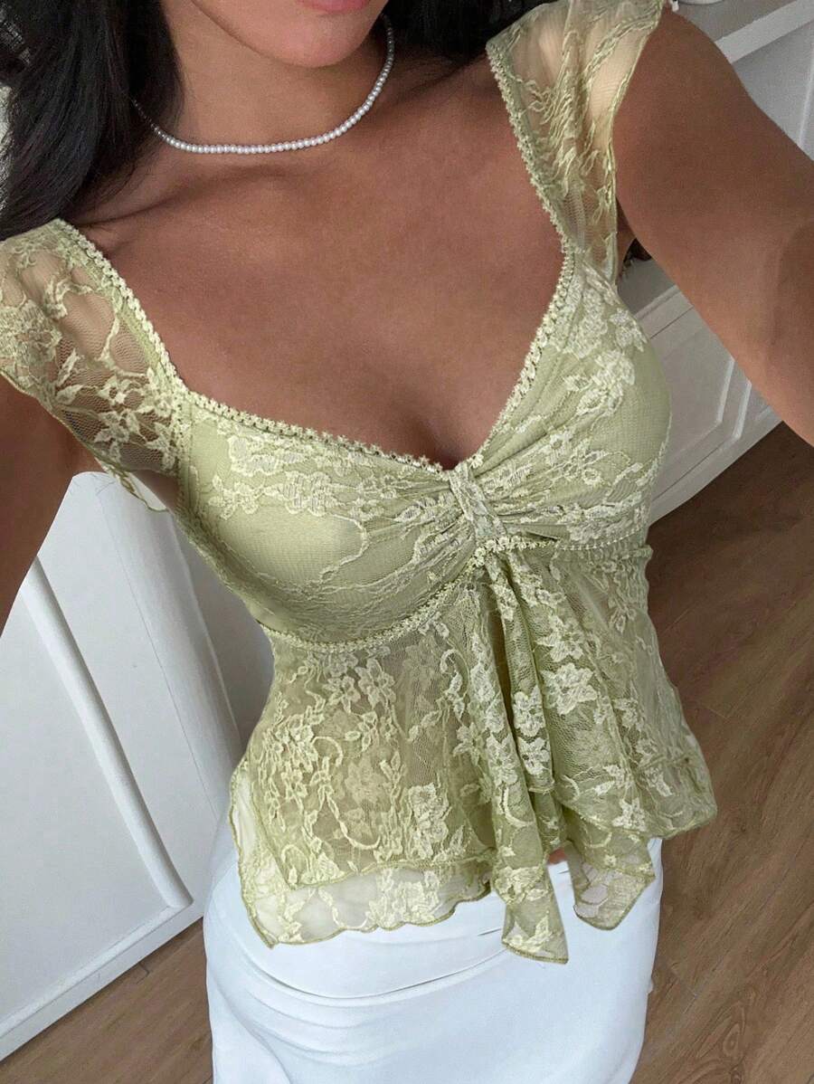 Flirty lace top with ruffles, sweetheart neckline and short sleeves