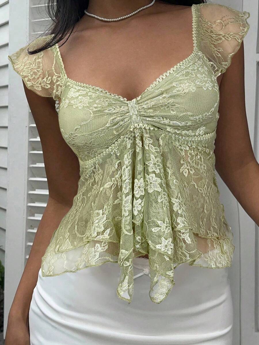 Flirty lace top with ruffles, sweetheart neckline and short sleeves