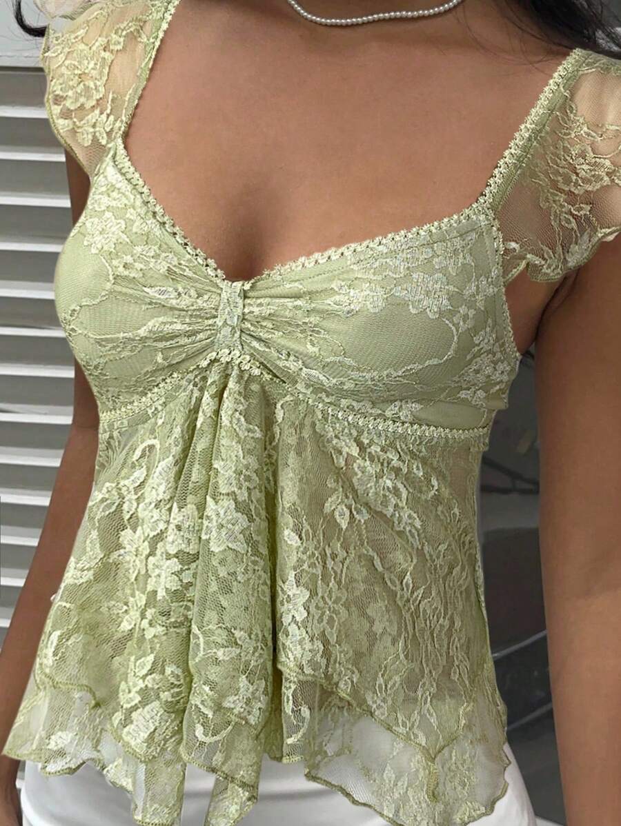 Flirty lace top with ruffles, sweetheart neckline and short sleeves