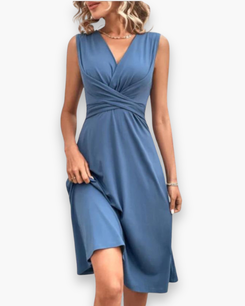 Sleeveless floral midi dress, elegant and flowing, with a crossed neckline