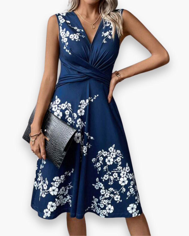 Sleeveless floral midi dress, elegant and flowing, with a crossed neckline