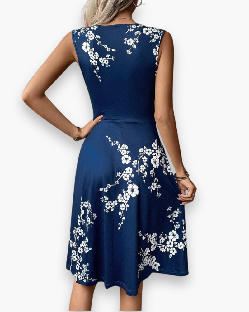 Sleeveless floral midi dress, elegant and flowing, with a crossed neckline