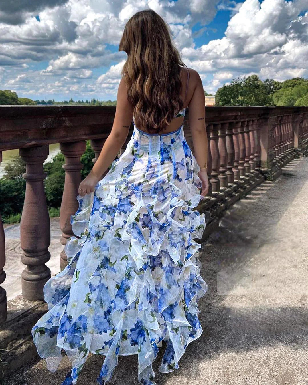 Long evening dress with ruffles and romantic floral pattern for women
