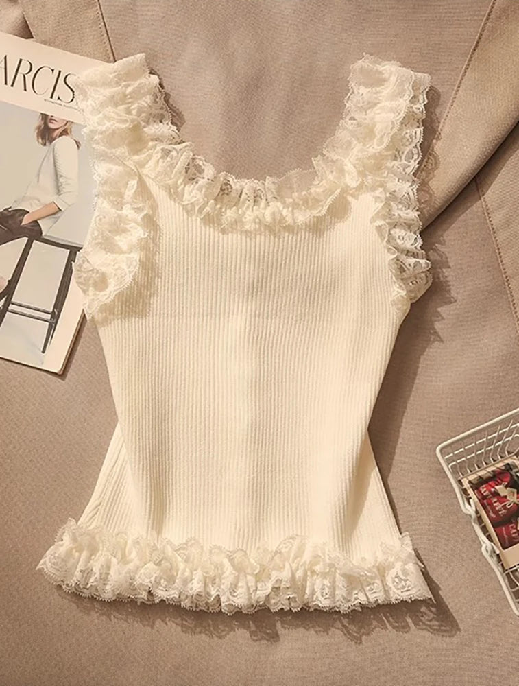 Flirty knit patchwork lace top with ruffles and U-neck collar