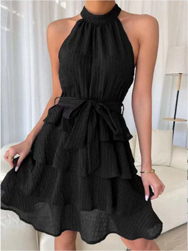 Chic women's dress with flounced hem, halter bustier, and layered ruffles