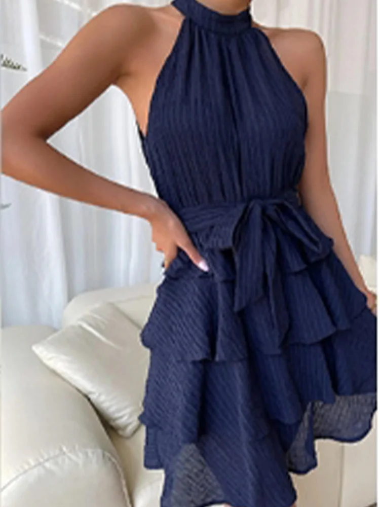 Chic women's dress with flounced hem, halter bustier, and layered ruffles