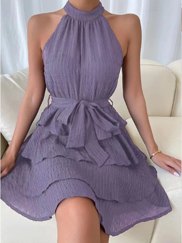 Chic women's dress with flounced hem, halter bustier, and layered ruffles