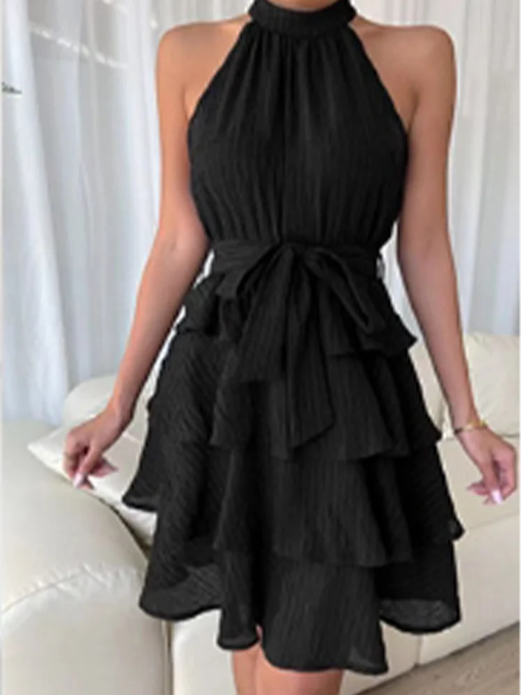 Chic women's dress with flounced hem, halter bustier, and layered ruffles