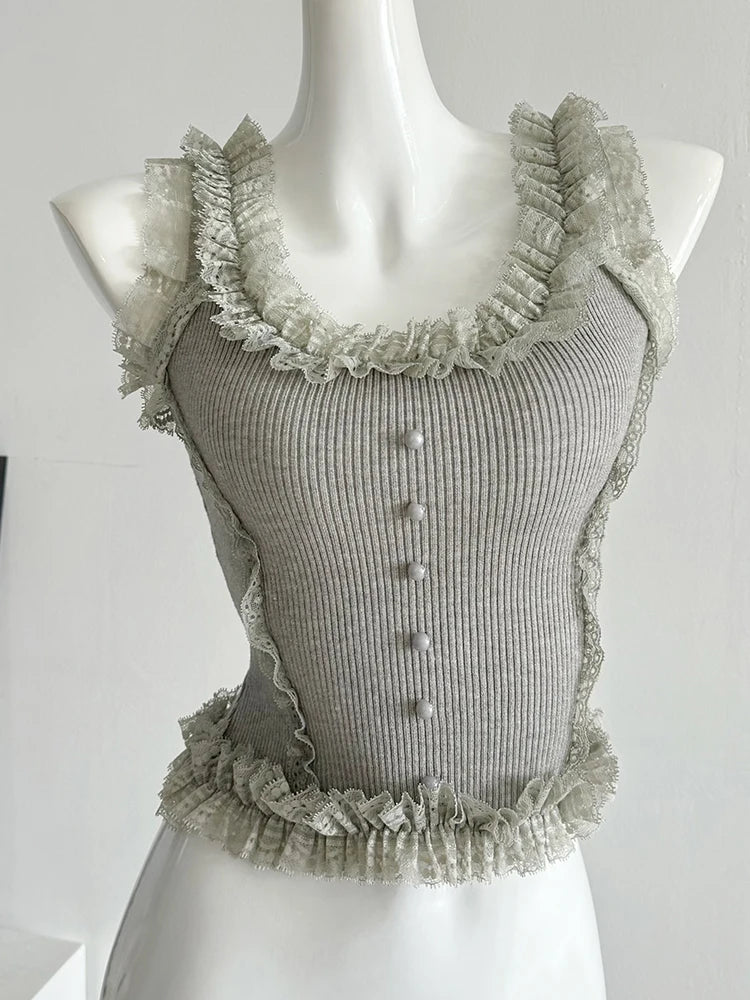 Flirty knit patchwork lace top with ruffles and U-neck collar